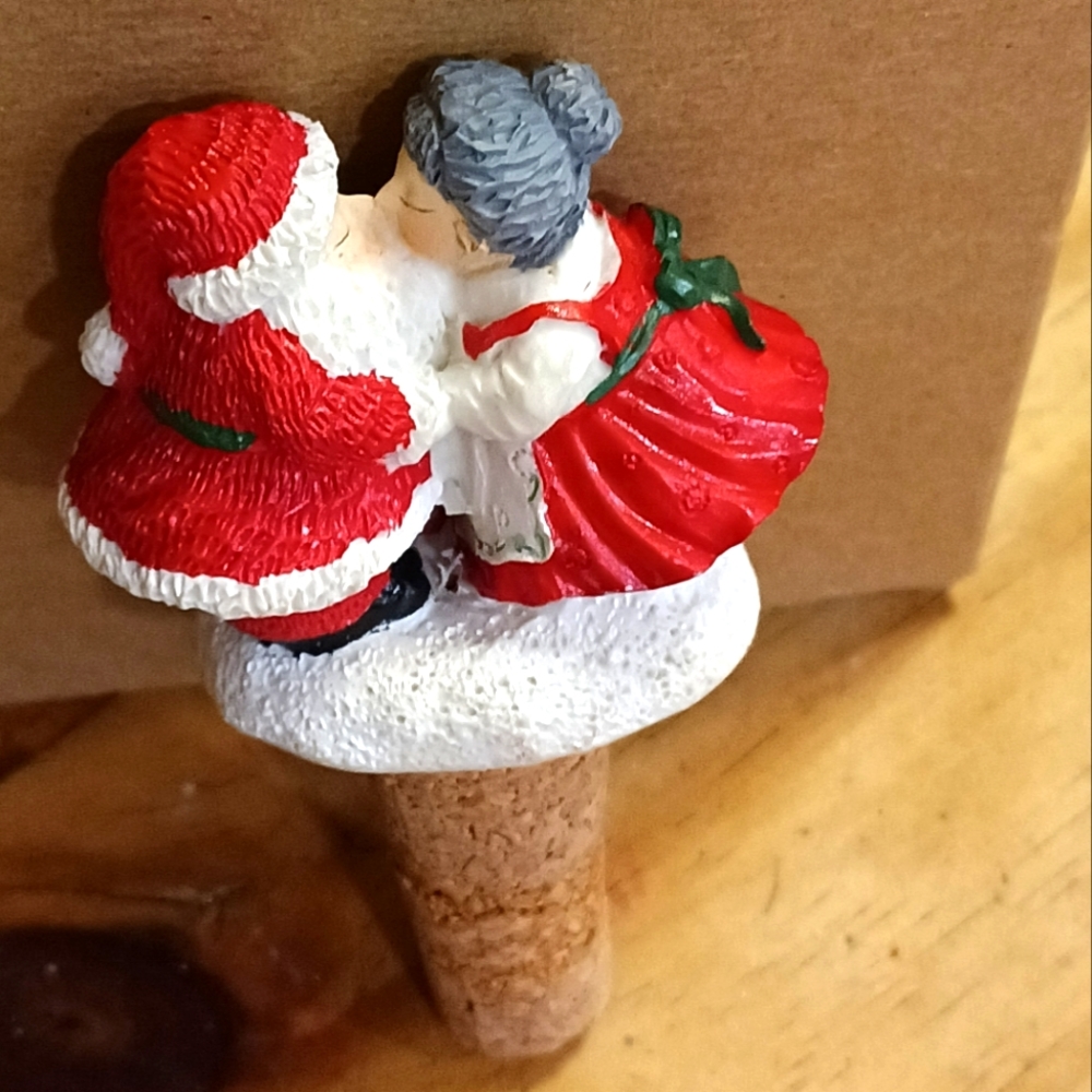 Santa and Mrs. Clause kissing wine bottle sealer